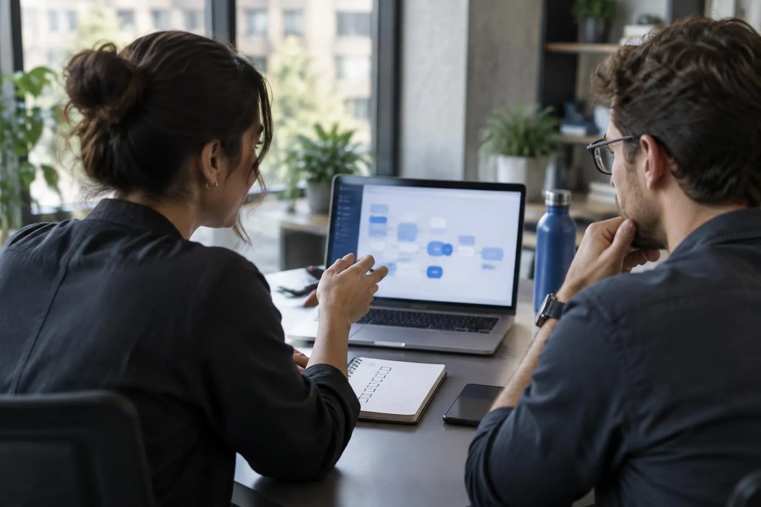 Operations professionals reviewing a customer communication workflow together